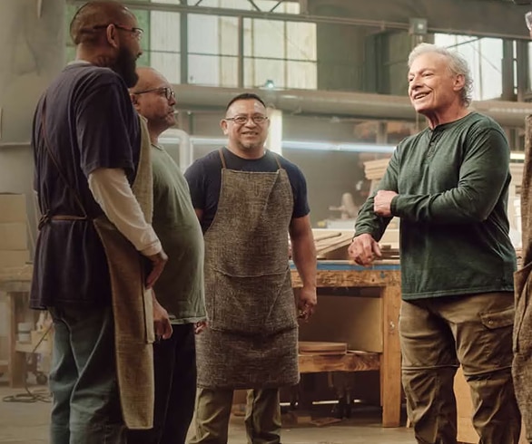 Group of workers gathered in industrial workshop